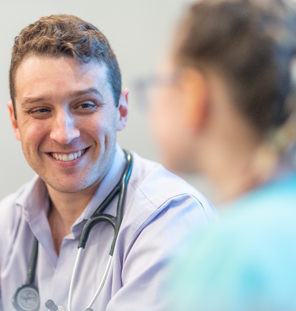 Orlando Florida pediatrician smiling at a parent