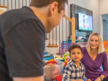 Doctor Weiss visiting a child and their mother in their home