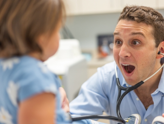 Doctor Weiss making an excited expression at a young girl