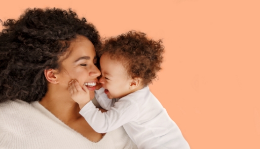 Mother laughing with her baby