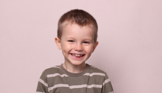 Young boy grinning